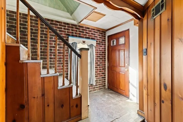 a storage room with a stove top oven and sink