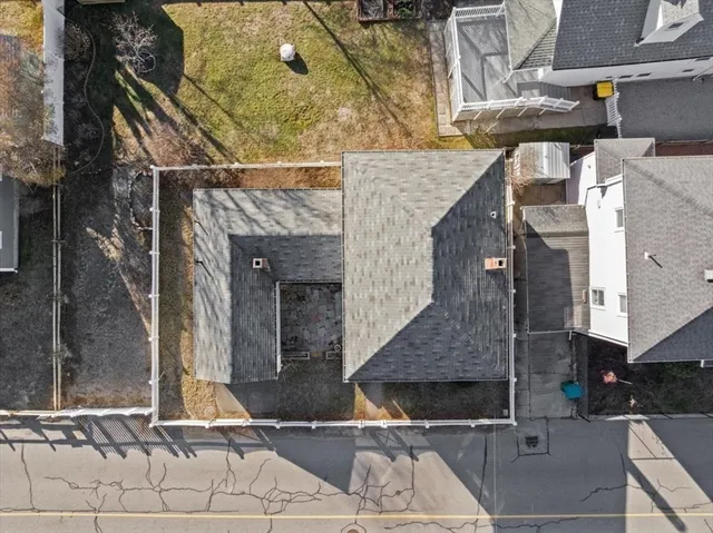 a view of a house with wooden fence