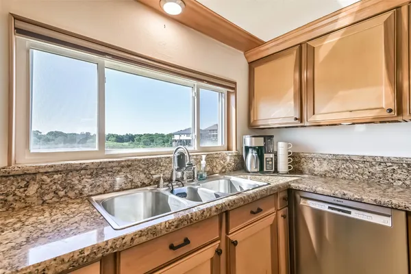a stove top oven sitting inside of a kitchen