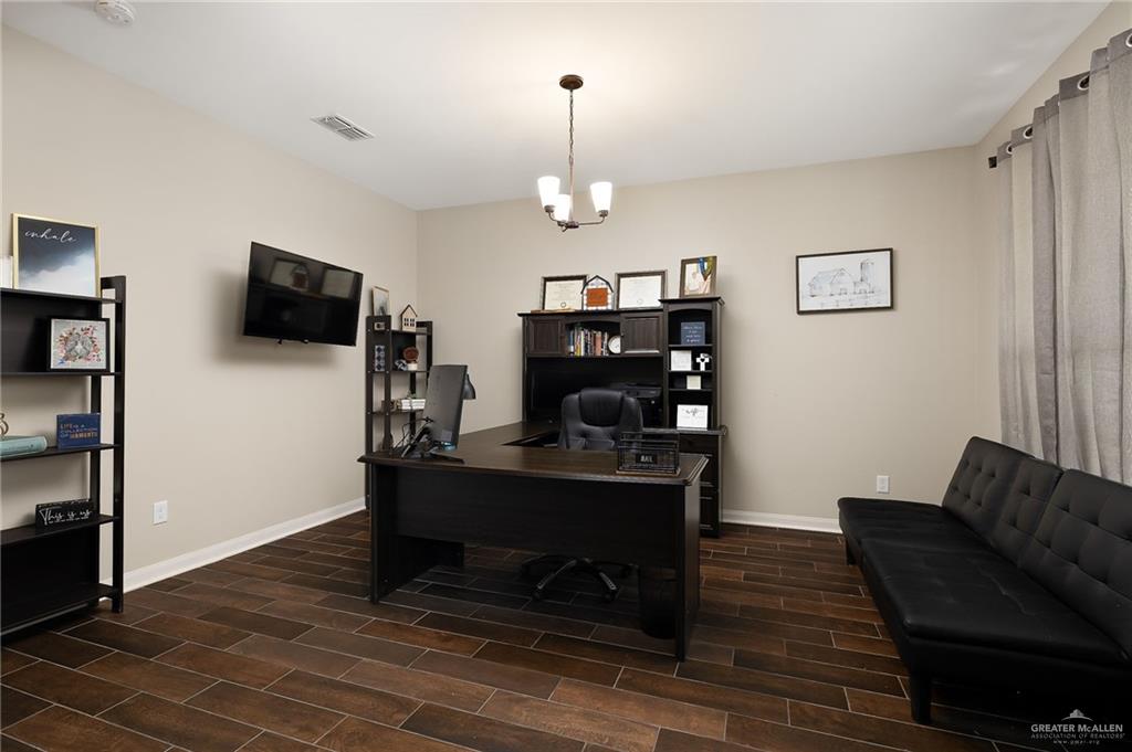 6323 Cascada Bnd Road McAllen, TX 78504 - Photo 6 of 26 a view of a livingroom with furniture and wooden floor