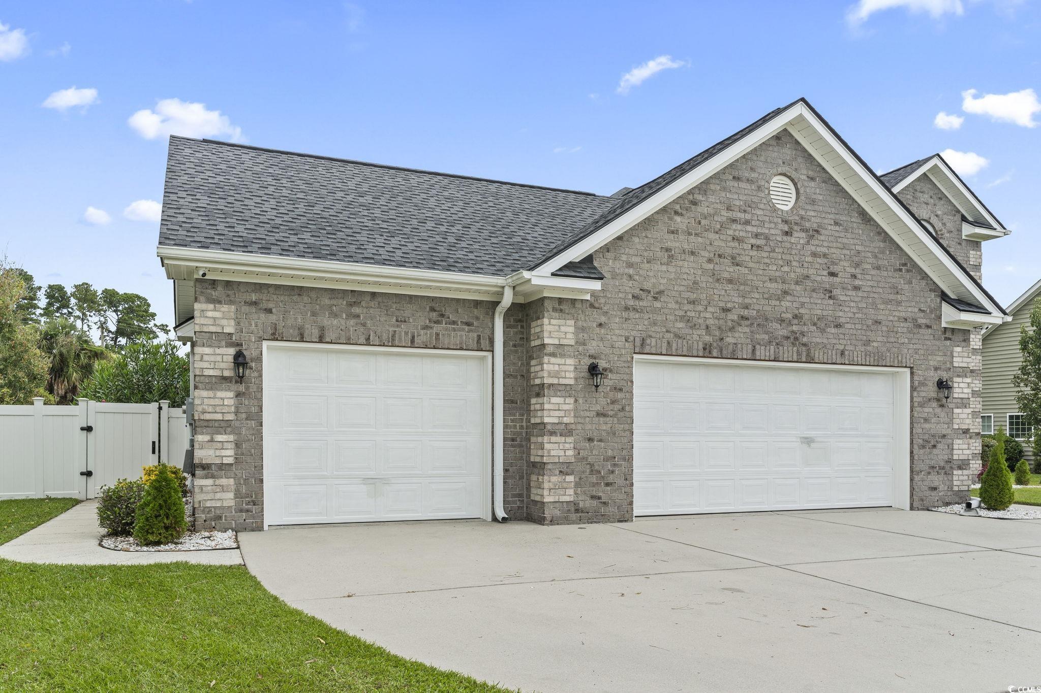 212 Duchess Court Myrtle Beach, SC 29588 - Photo 12 of 40 Oversized 3 car garage easily houses vehicles, tows and workshop