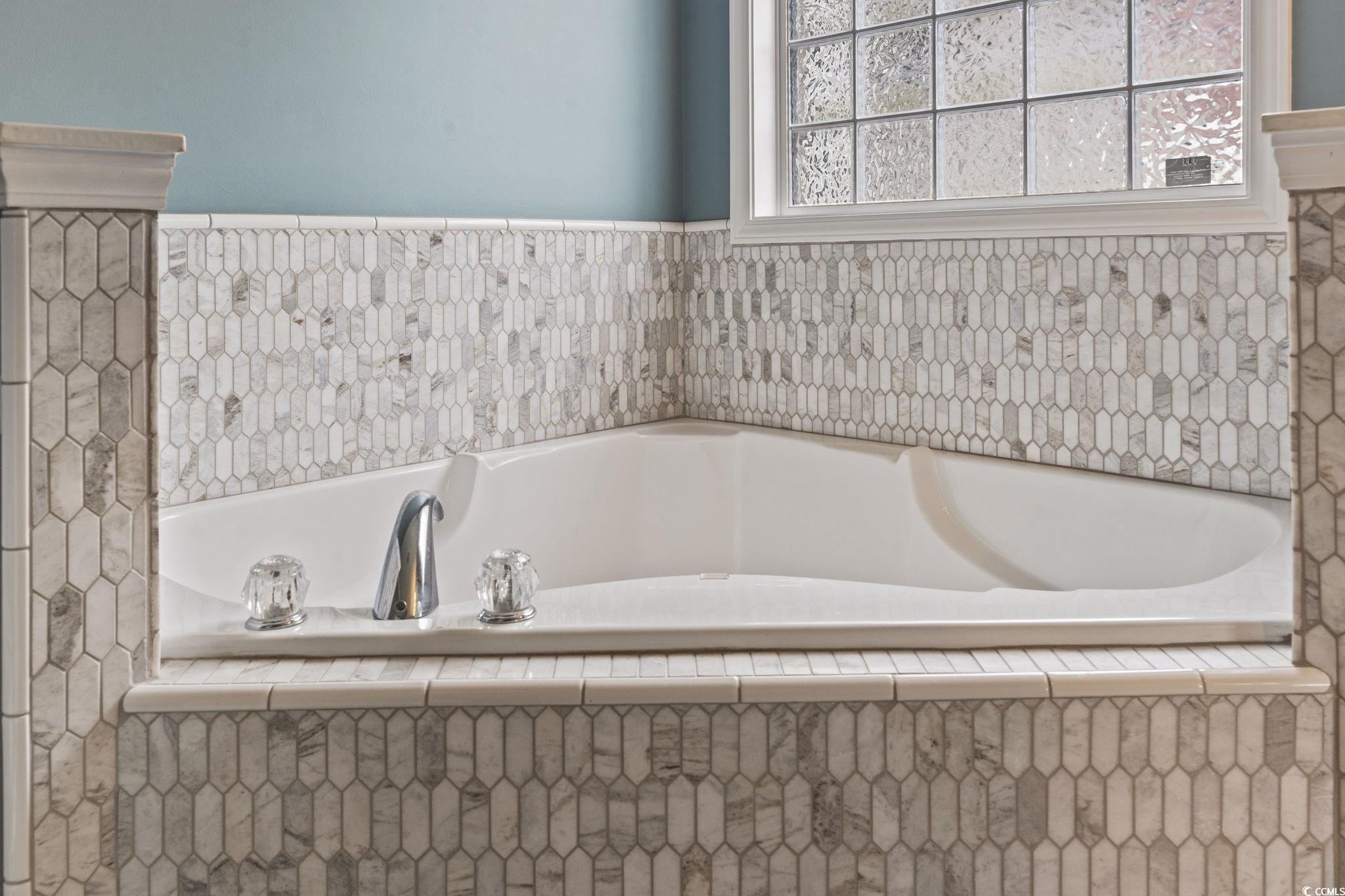 212 Duchess Court Myrtle Beach, SC 29588 - Photo 17 of 40 Garden tub features decorative tile surround