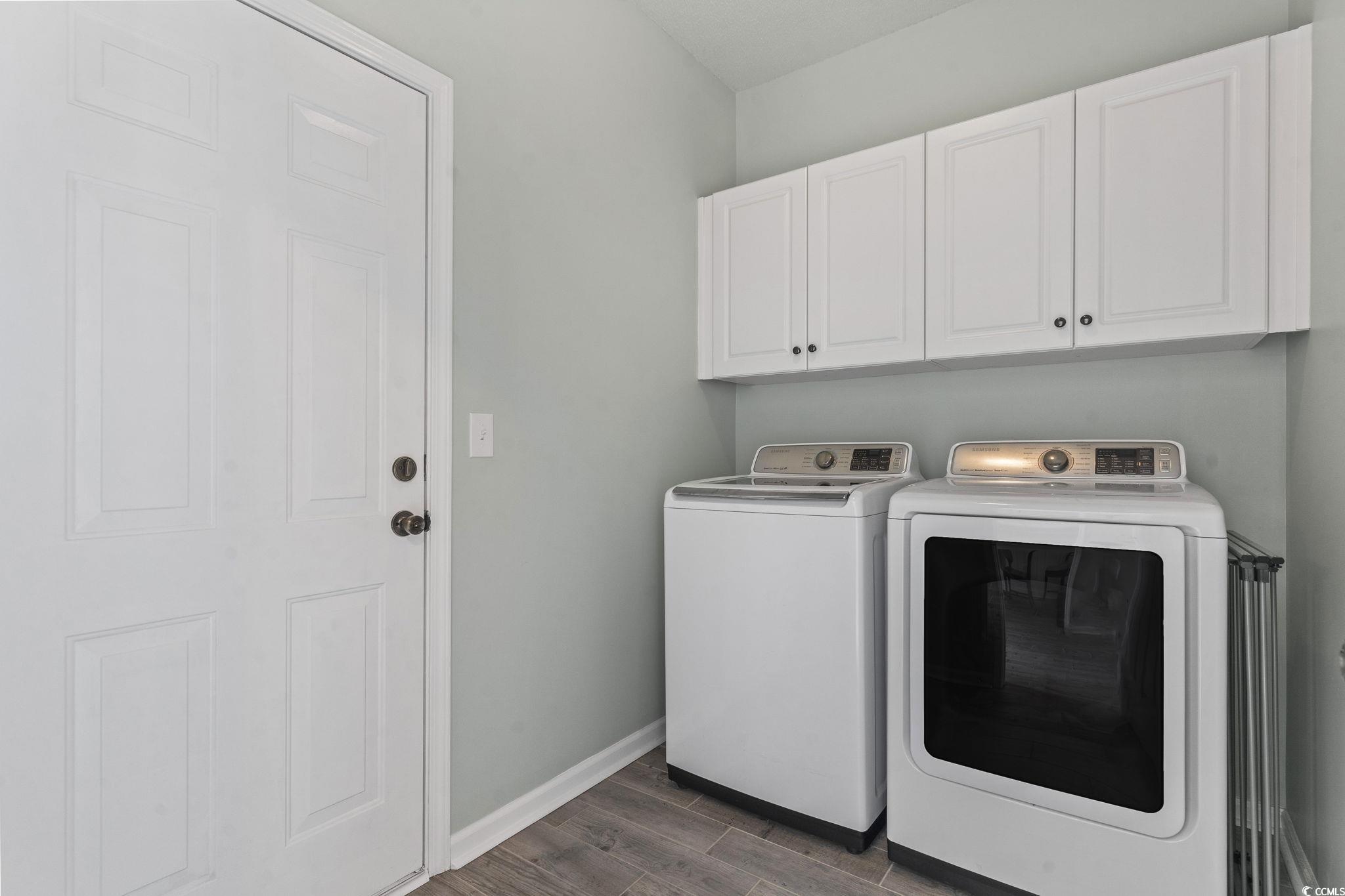 212 Duchess Court Myrtle Beach, SC 29588 - Photo 28 of 40 Laundry room with wood finish floors, cabinet space, and independent washer and dryer