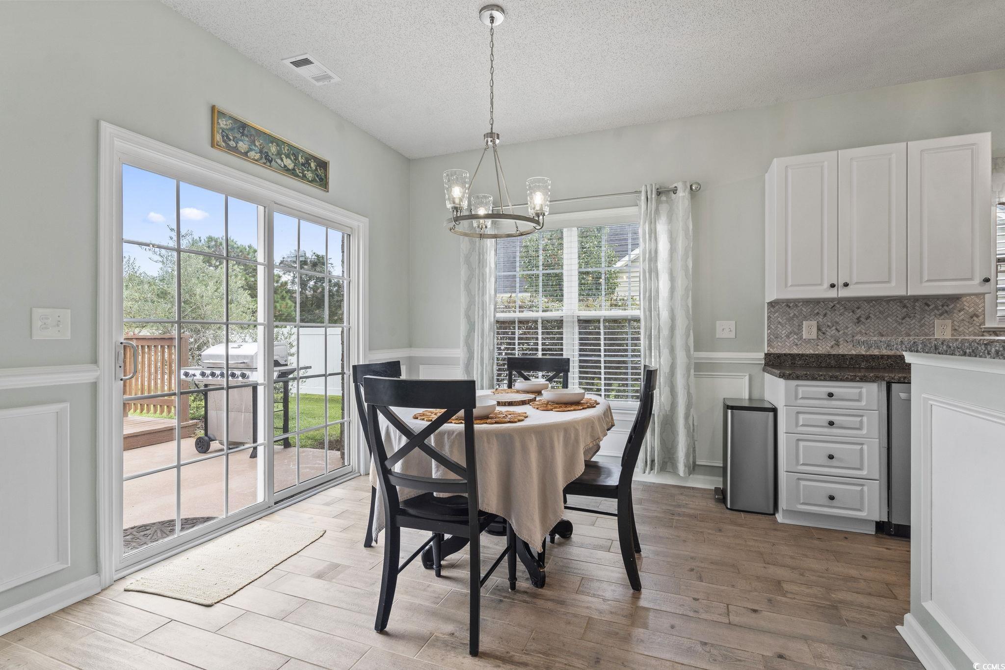 212 Duchess Court Myrtle Beach, SC 29588 - Photo 6 of 40 Breakfast Nook is perfect complment to Breakfast Bar opening to rear grilling patio and deck