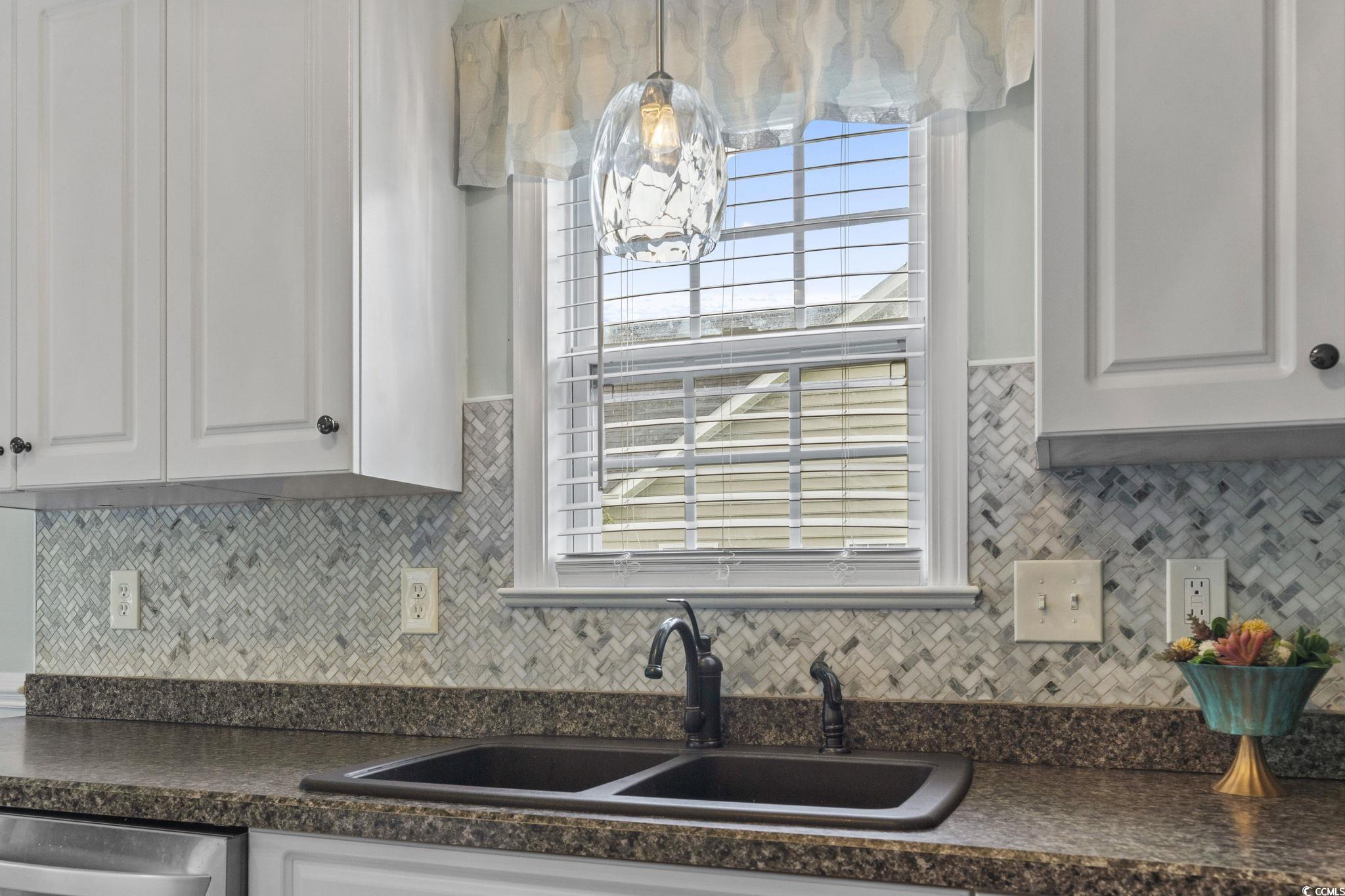 212 Duchess Court Myrtle Beach, SC 29588 - Photo 8 of 40 Kitchen featuring dark countertops, tasteful backsplash, and plenty of natural light
