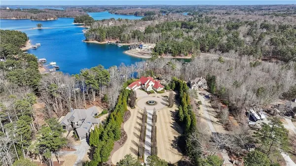 an aerial view of a house with a yard swimming pool