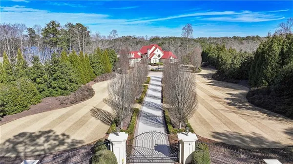 an aerial view of a house with a yard and garden