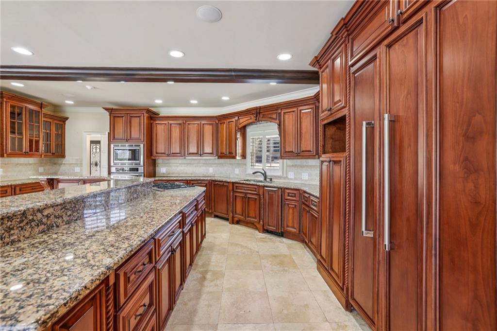 6525 Garrett Road Buford, GA 30518 - Photo 26 of 98 a kitchen with stainless steel appliances granite countertop a granite counter tops and a sink