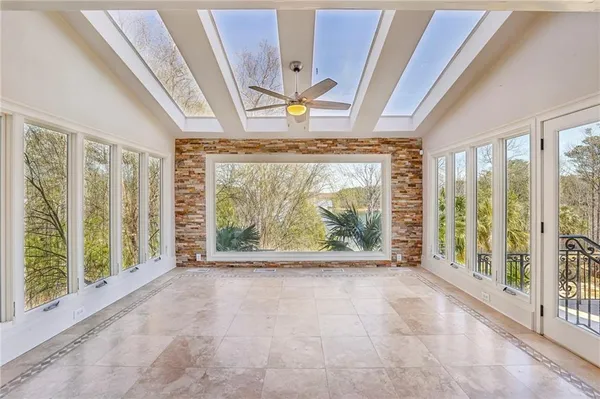 a view of wooden floor and windows in a room