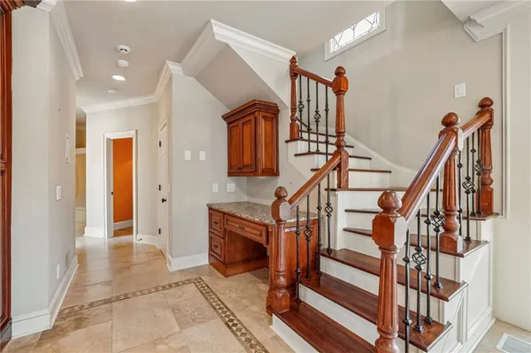 a view of entryway and hall with dining room