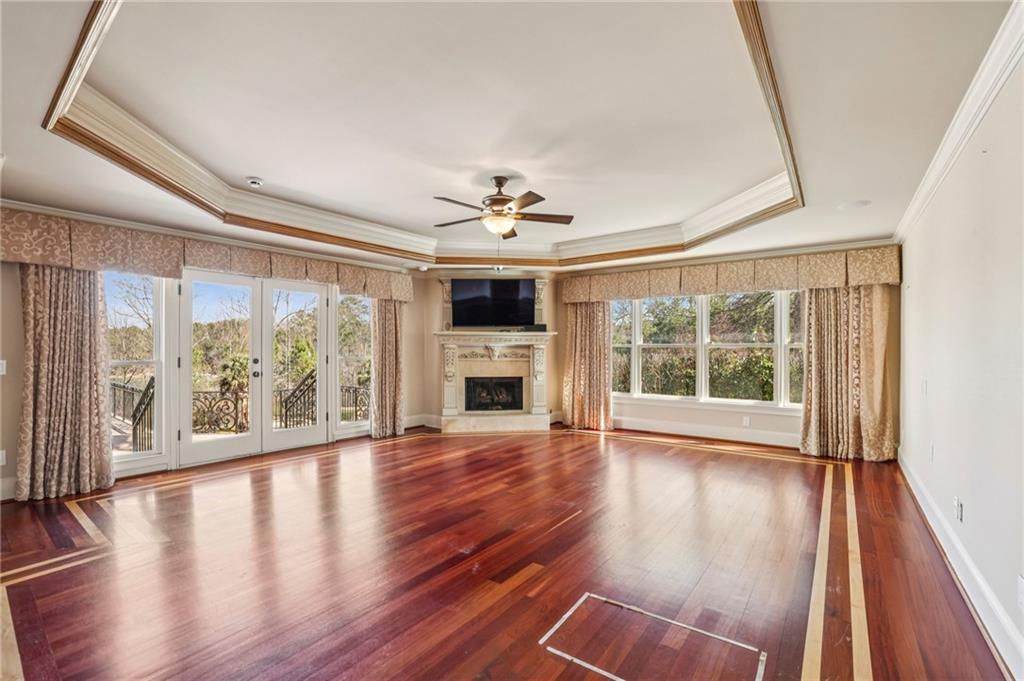 6525 Garrett Road Buford, GA 30518 - Photo 32 of 98 a view of an empty room with wooden floor and a window