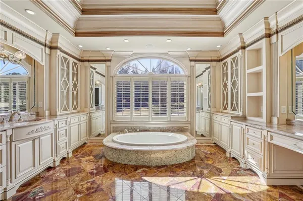 a view of a swimming pool with a yard and mountain in the background