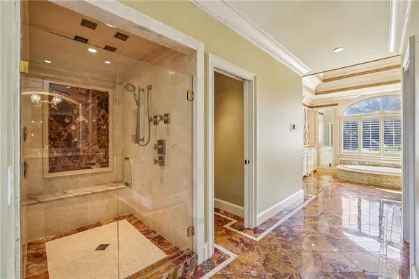 an aerial view of a house with a yard and lake view