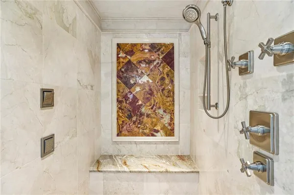 an aerial view of a house with a yard and lake view