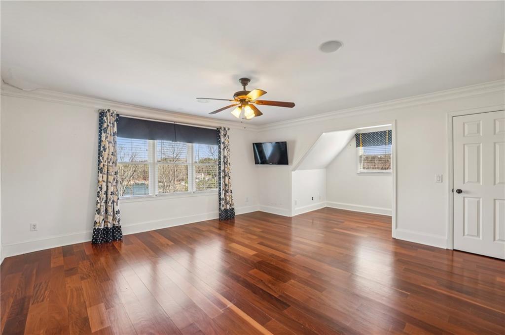 6525 Garrett Road Buford, GA 30518 - Photo 45 of 98 a view of an empty room with wooden floor and a window