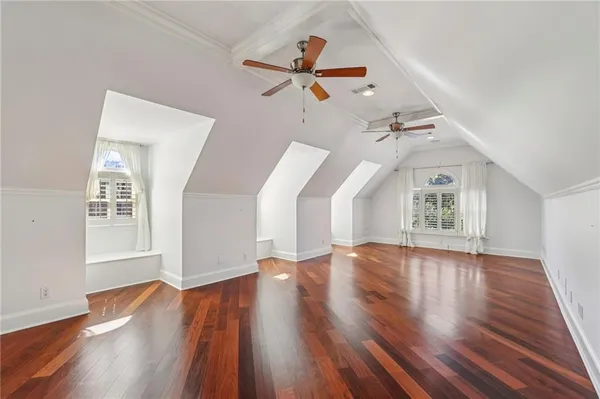 a bedroom with furniture and a fireplace