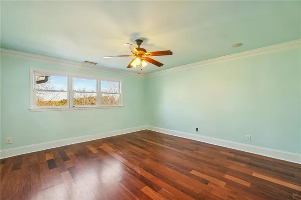 a bedroom with a bed and flat screen tv
