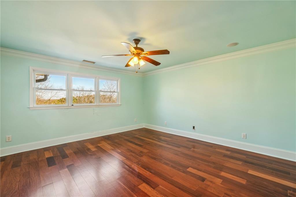 6525 Garrett Road Buford, GA 30518 - Photo 49 of 98 wooden floor in an empty room with a window