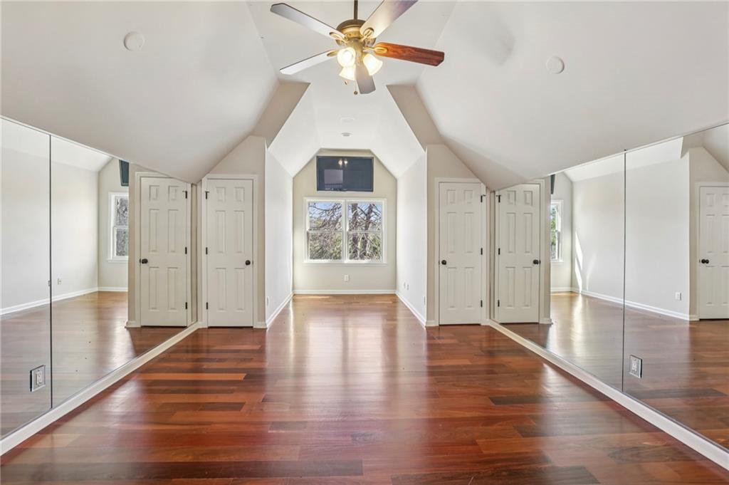 6525 Garrett Road Buford, GA 30518 - Photo 50 of 98 a view of an empty room with window and wooden floor