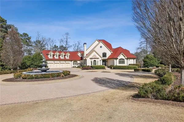 a view of a room with wooden floor chandelier and entryway