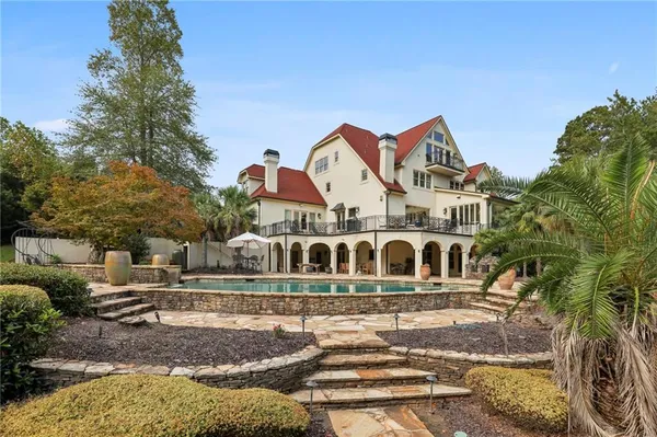 a view of a room with chandelier and wooden floor
