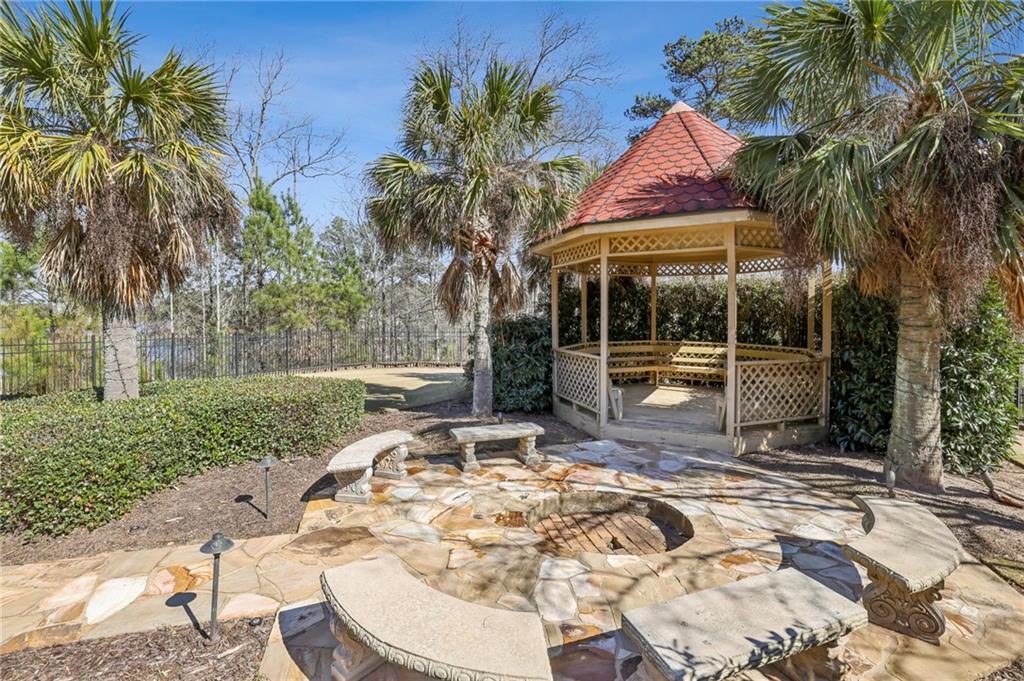 6525 Garrett Road Buford, GA 30518 - Photo 77 of 98 a view of a backyard with a patio