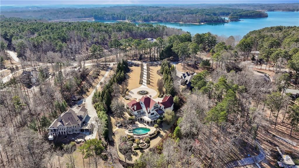 6525 Garrett Road Buford, GA 30518 - Photo 80 of 98 an aerial view of a house with a yard and lake view