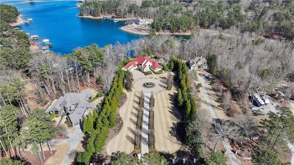 6525 Garrett Road Buford, GA 30518 - Photo 80 of 98 an aerial view of a house with a yard and lake view