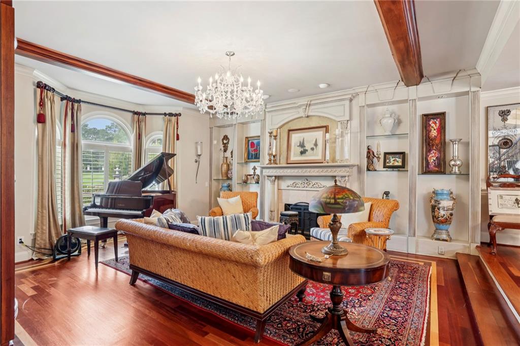 6525 Garrett Road Buford, GA 30518 - Photo 84 of 98 a living room with furniture and a chandelier