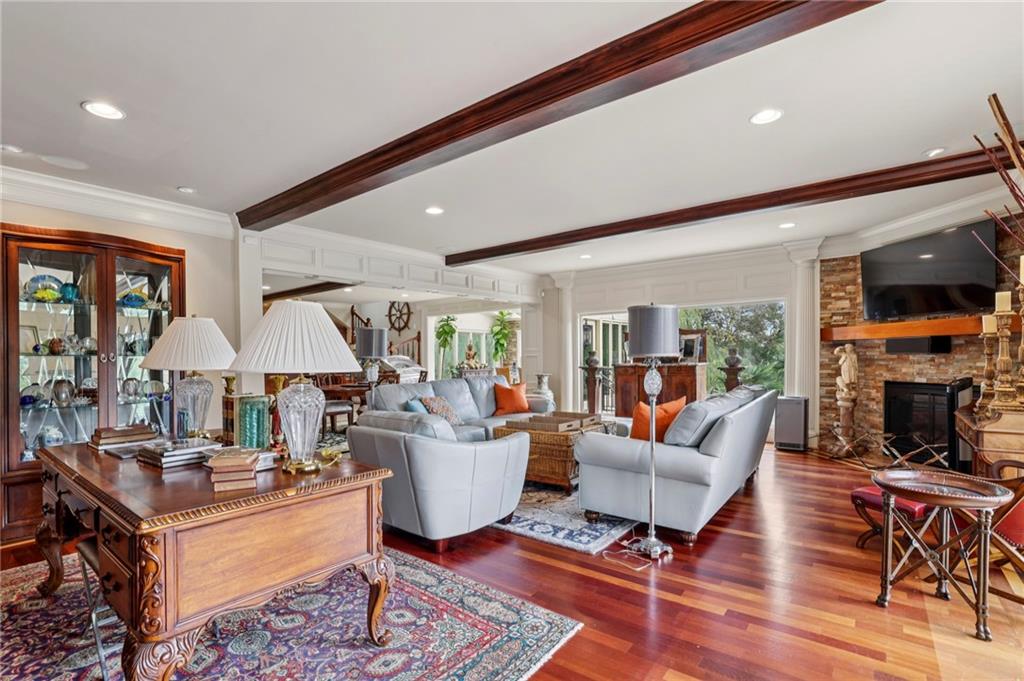 6525 Garrett Road Buford, GA 30518 - Photo 87 of 98 a living room with furniture a fireplace and a table
