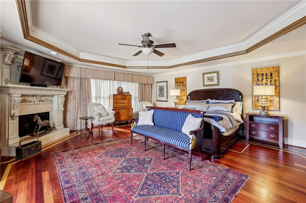 6525 Garrett Road Buford, GA 30518 - Photo 88 of 98 a bedroom with furniture and a fireplace
