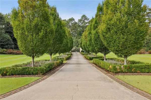 a large kitchen with stainless steel appliances granite countertop a large stove a sink and a large island