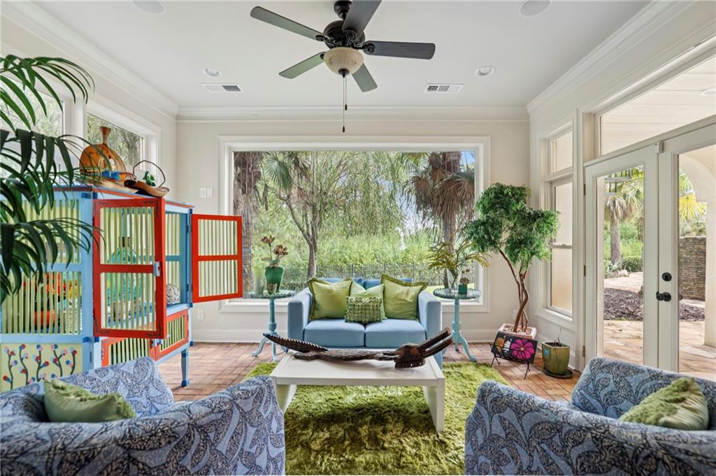 6525 Garrett Road Buford, GA 30518 - Photo 96 of 98 a living room with patio furniture and a floor to ceiling window