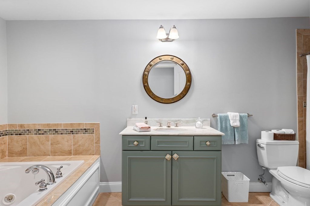 91 Front Street, Unit 104 Scituate, MA 02066 - Photo 18 of 26 a bathroom with a sink and a mirror