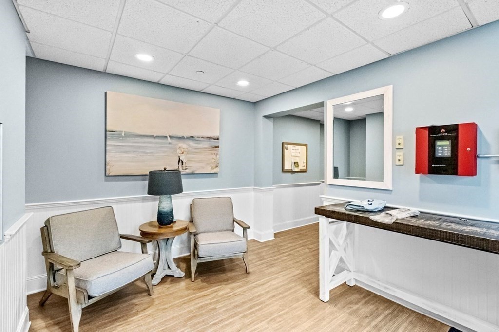 91 Front Street, Unit 104 Scituate, MA 02066 - Photo 23 of 26 a living room with furniture and a wooden floor