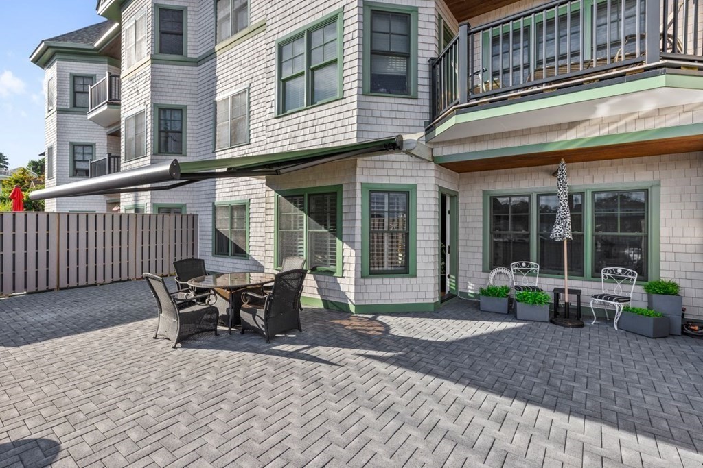 91 Front Street, Unit 104 Scituate, MA 02066 - Photo 5 of 26 a view of a building with sitting area