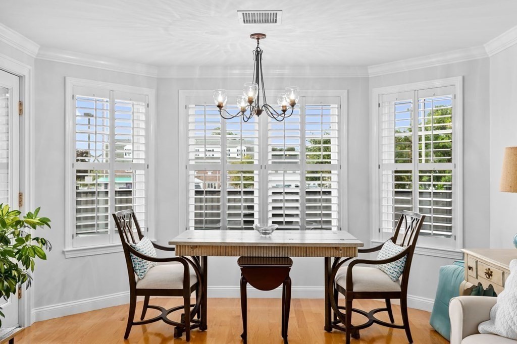91 Front Street, Unit 104 Scituate, MA 02066 - Photo 7 of 26 a view of a dining room with furniture window and outside view