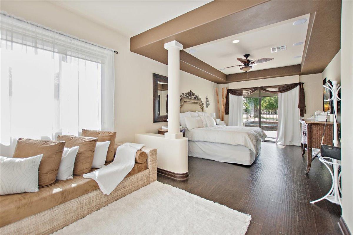 82553 Doolittle Drive Indio, CA 92201 - Photo 18 of 47 a bedroom with furniture and a large window