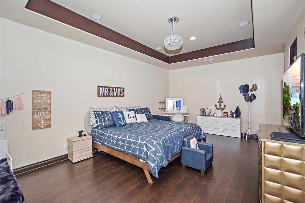 82553 Doolittle Drive Indio, CA 92201 - Photo 24 of 47 a bedroom with a bed couch and a large window