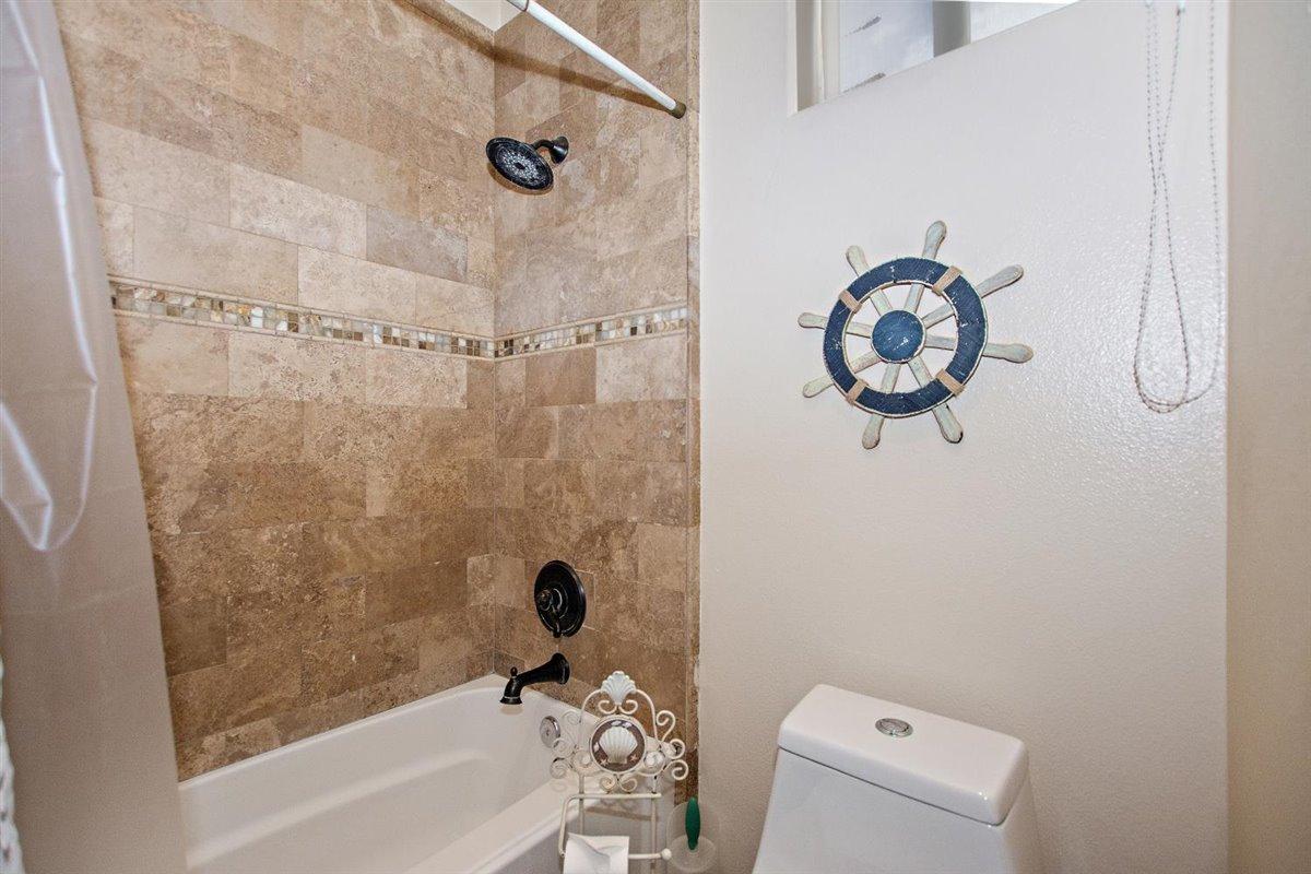 82553 Doolittle Drive Indio, CA 92201 - Photo 25 of 47 a bathroom with a shower and a bathtub
