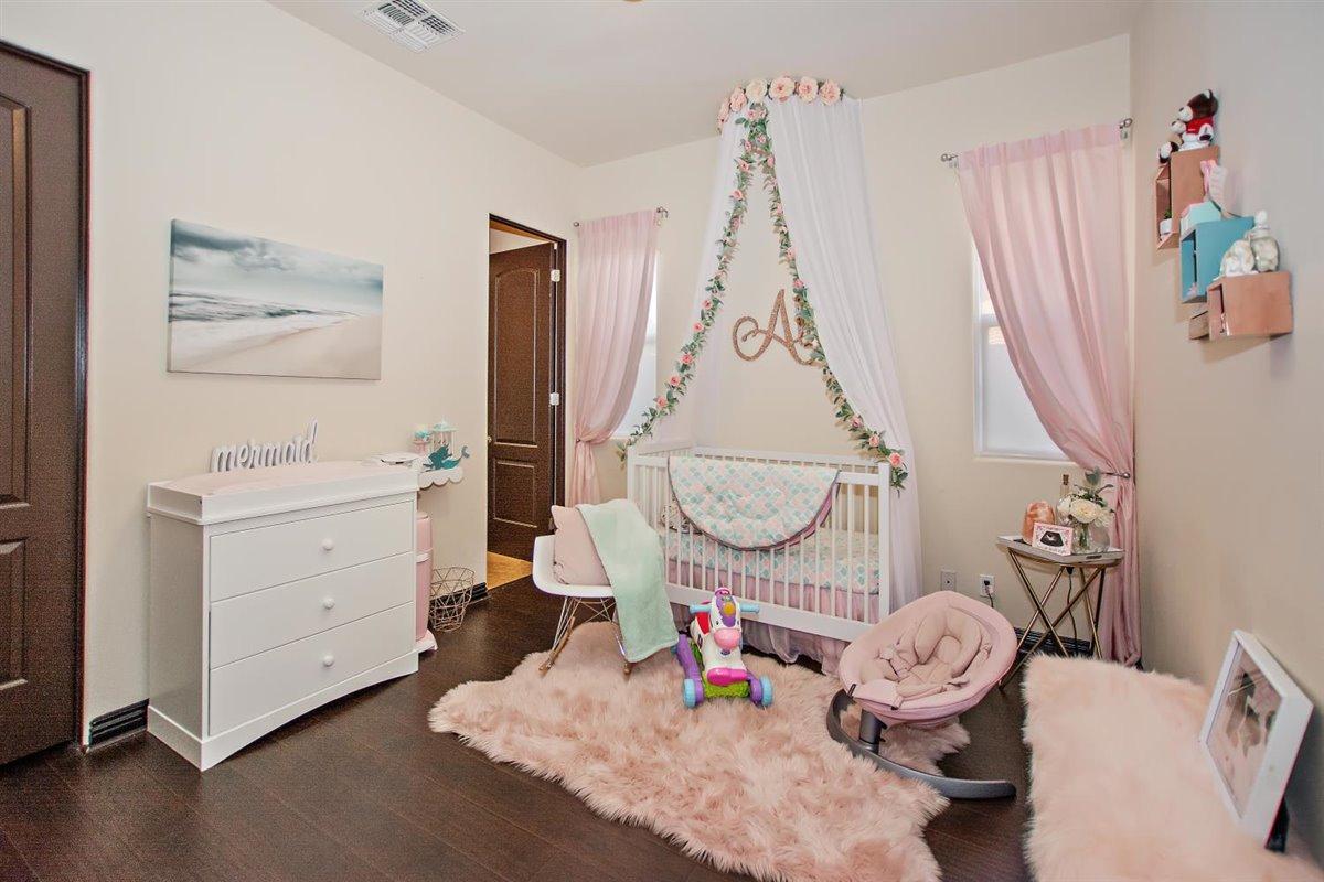 82553 Doolittle Drive Indio, CA 92201 - Photo 27 of 47 a view of living room with furniture and wooden floor
