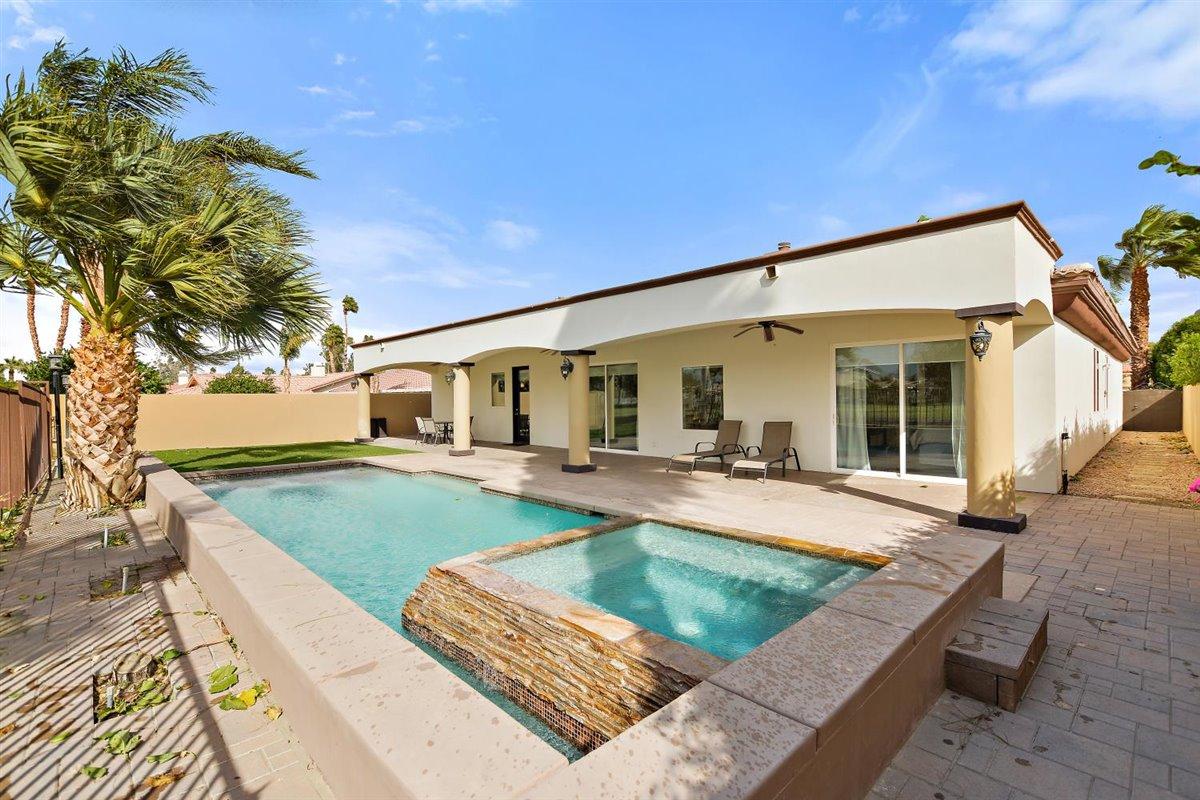 82553 Doolittle Drive Indio, CA 92201 - Photo 37 of 47 a view of a house with swimming pool and sitting area