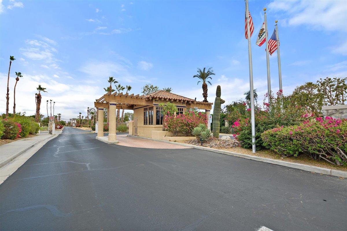 82553 Doolittle Drive Indio, CA 92201 - Photo 44 of 47 a view of a street with a building and car parked on the road