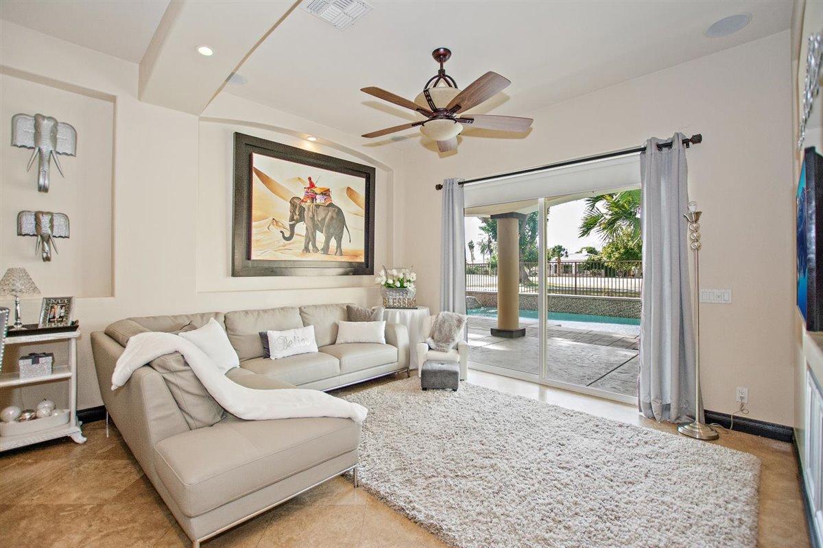 82553 Doolittle Drive Indio, CA 92201 - Photo 5 of 47 a living room with furniture and a large window