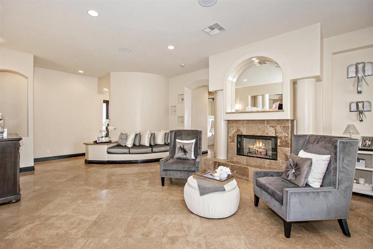 82553 Doolittle Drive Indio, CA 92201 - Photo 7 of 47 a living room with furniture and a fireplace