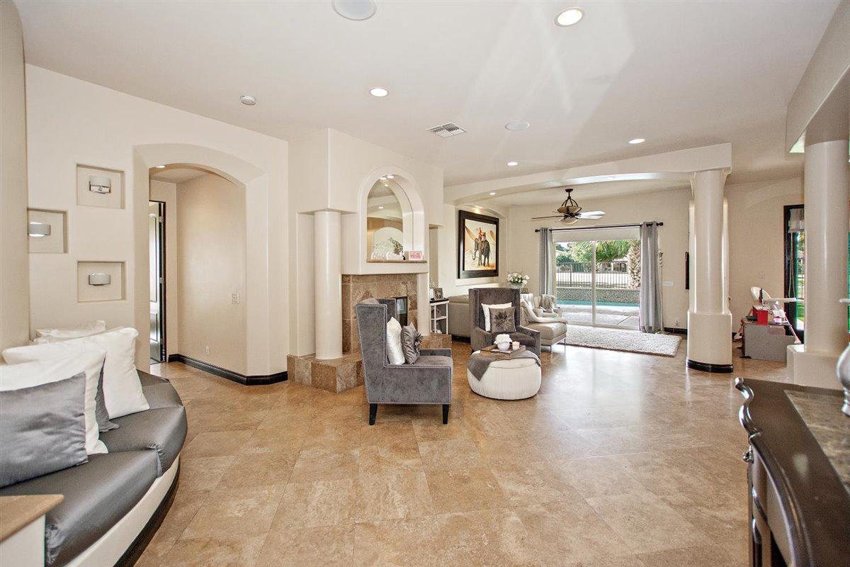 82553 Doolittle Drive Indio, CA 92201 - Photo 8 of 47 a living room with furniture and wooden floor