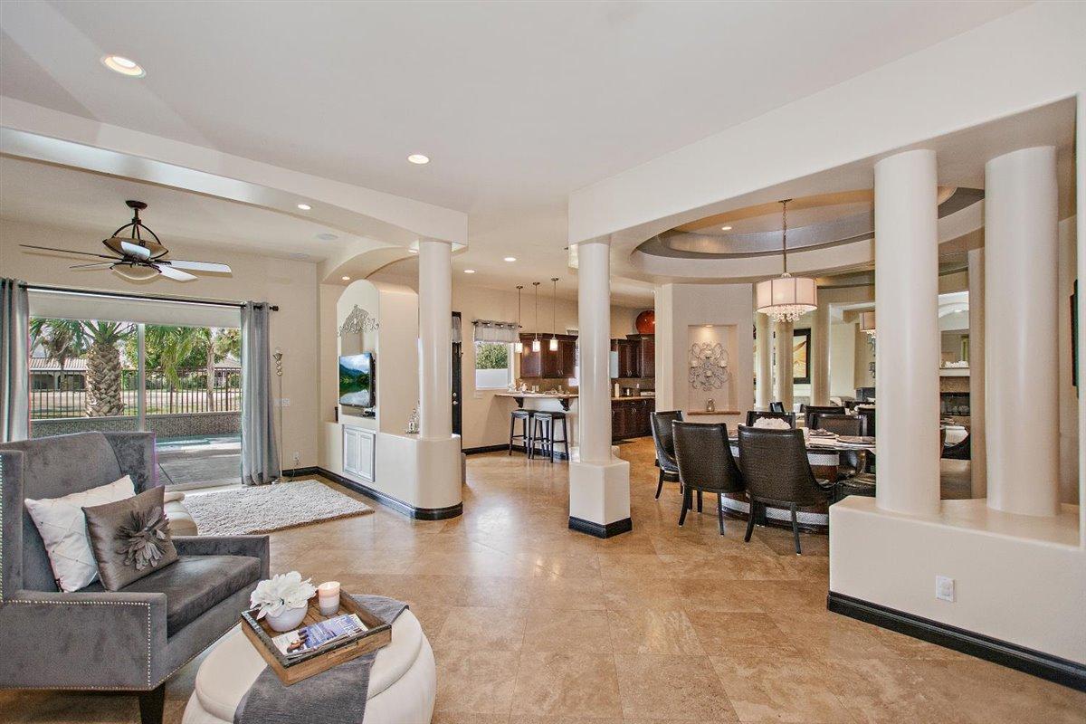 82553 Doolittle Drive Indio, CA 92201 - Photo 9 of 47 a living room with furniture and a large window