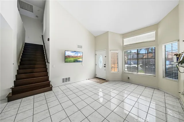 a view of an empty room with windows