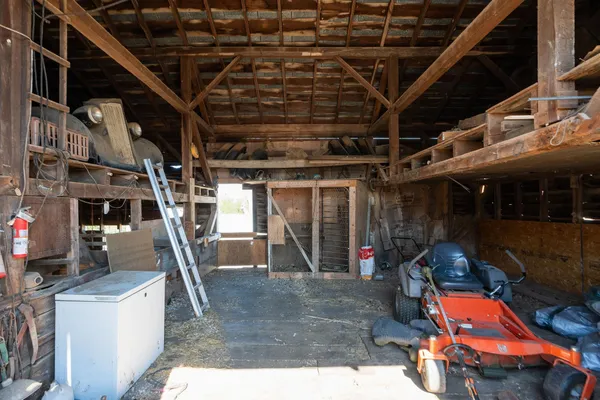 a view of a garage with parked cars