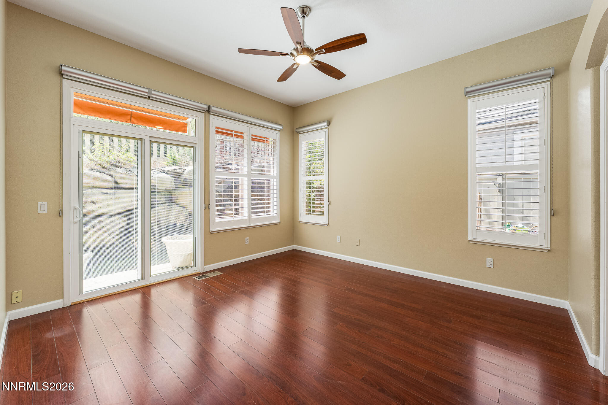 1840 Hunter Creek Road Reno, NV 89519 - Photo 15 of 39 a view of an empty room with wooden floor and a window